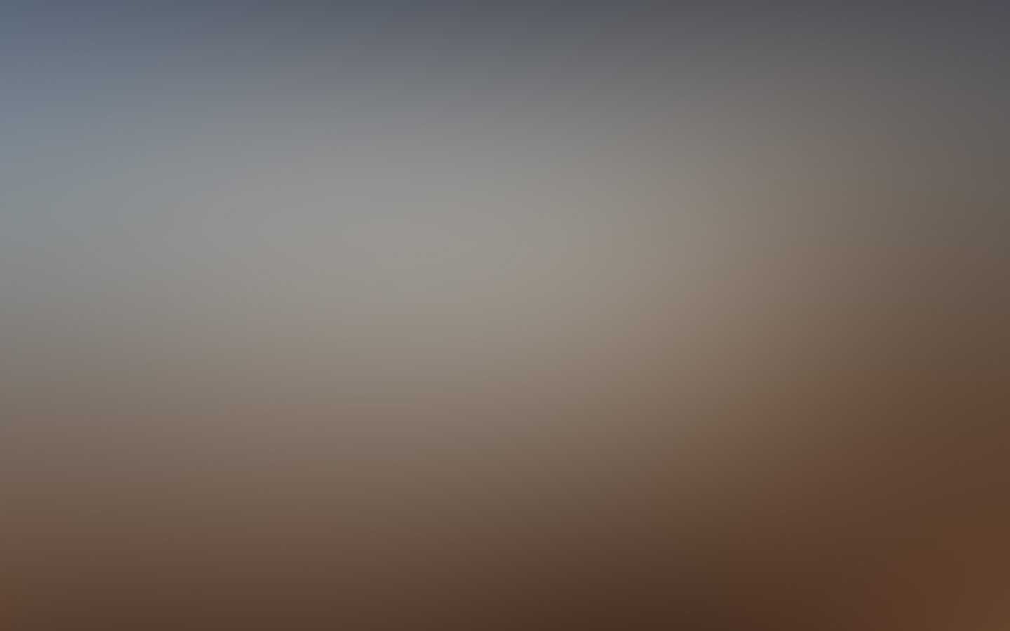 A soft abstract field of dusk blue and warm umber