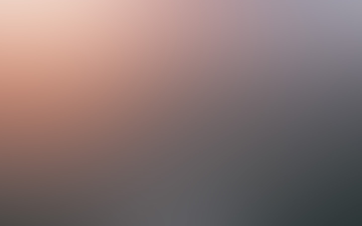 A soft horizon of peach light and deep charcoal